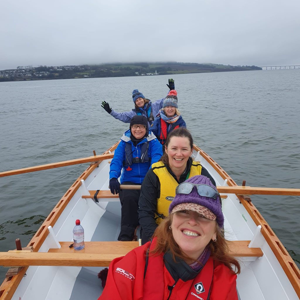 Smiling rowers